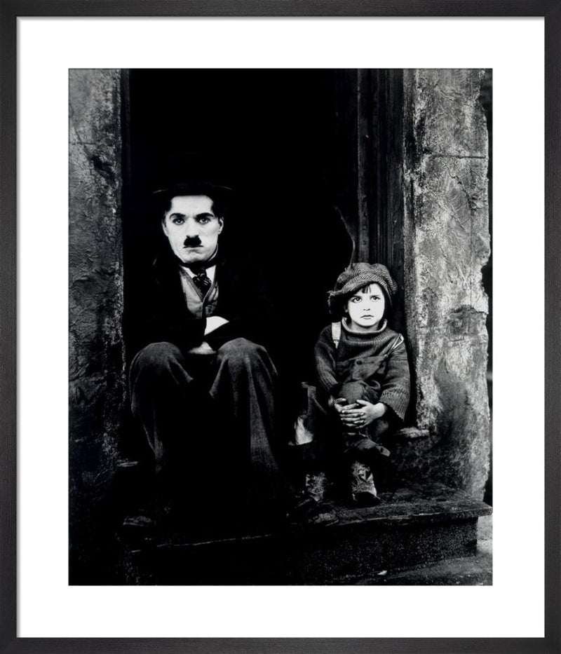 Charlie Chaplin (The Kid) by Hollywood Photo Archive. Framed art print.