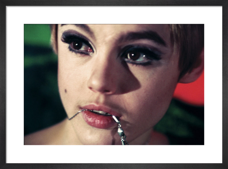 Edie Sedgwick with chain by Nat Finkelstein. Framed art print.