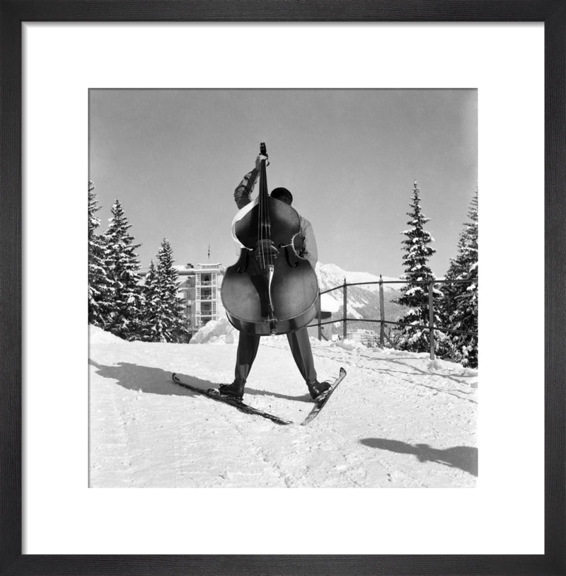 Skiing with Cello by Anonymous. Framed art print.