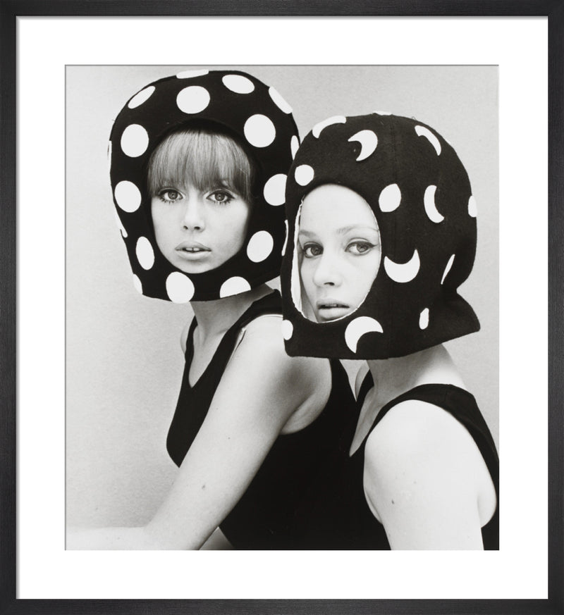 Two capsule line felt helmets by John French. Framed art print.
